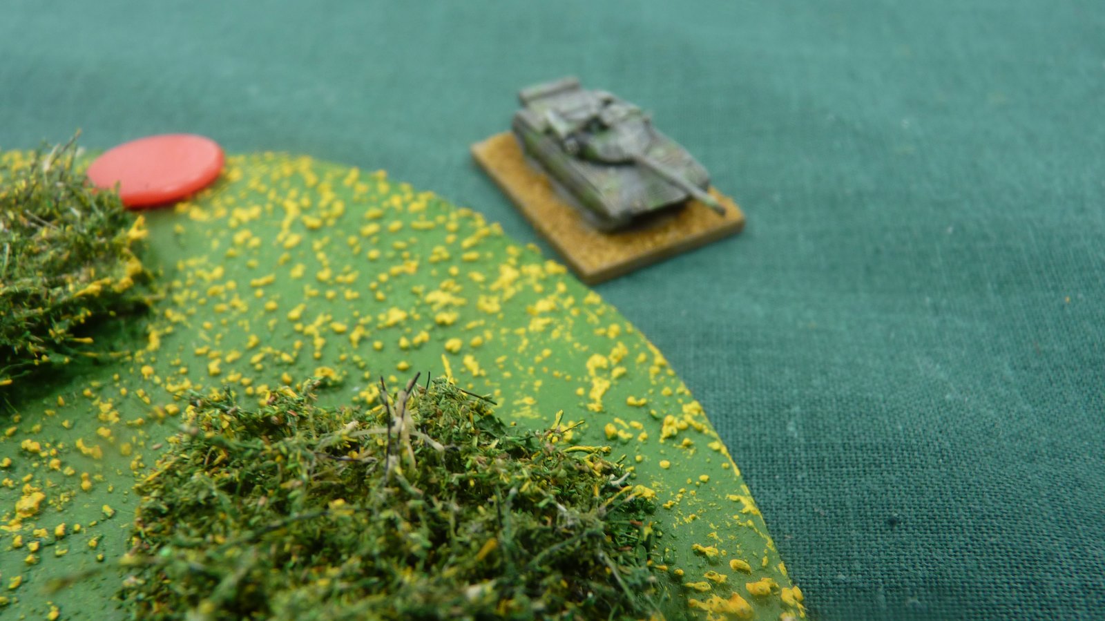 A lone Chinese tank uses the wood for cover as it moves into a firing positon